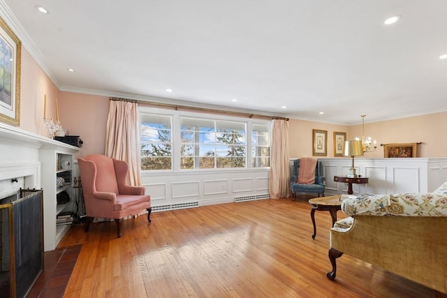 interior space with an inviting chandelier, crown molding, and wood-type flooring