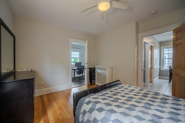 56 Marlboro St Unit 1, Belmont, MA 02478 - bedroom featuring multiple windows, baseboards, light wood-style flooring, and ceiling fan