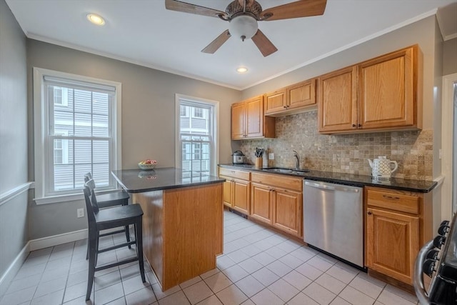 56 Marlboro St Unit 1, Belmont, MA 02478 - kitchen with stainless steel dishwasher, a sink, dark countertops, tasteful backsplash, and ornamental molding