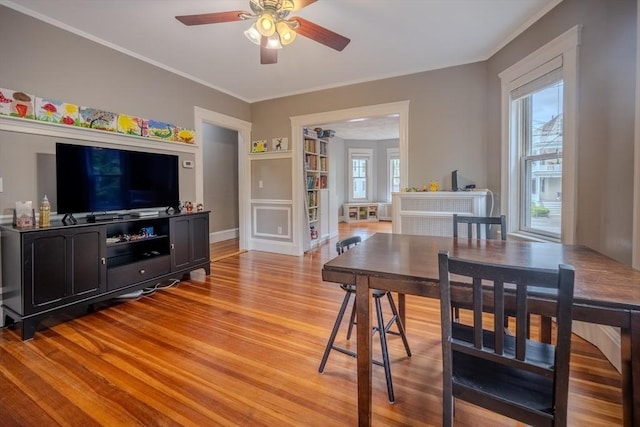 56 Marlboro St Unit 1, Belmont, MA 02478 - dining room featuring light wood-style flooring, ceiling fan, crown molding, and built in features