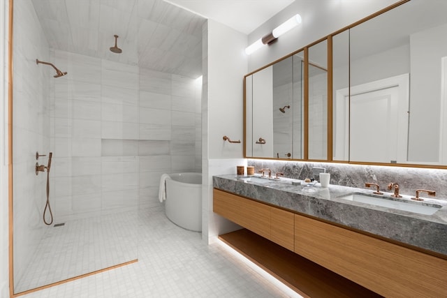 bathroom featuring double vanity, tile walls, tiled shower, decorative backsplash, and tile patterned floors