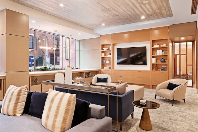 carpeted living room with wood ceiling and built in shelves