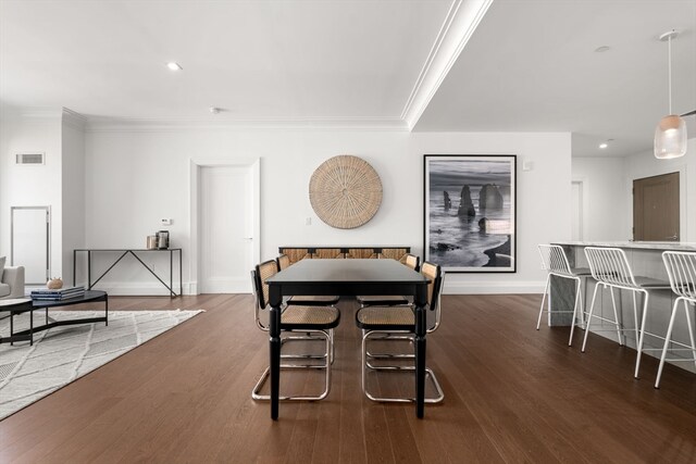 dining area with dark hardwood / wood-style floors