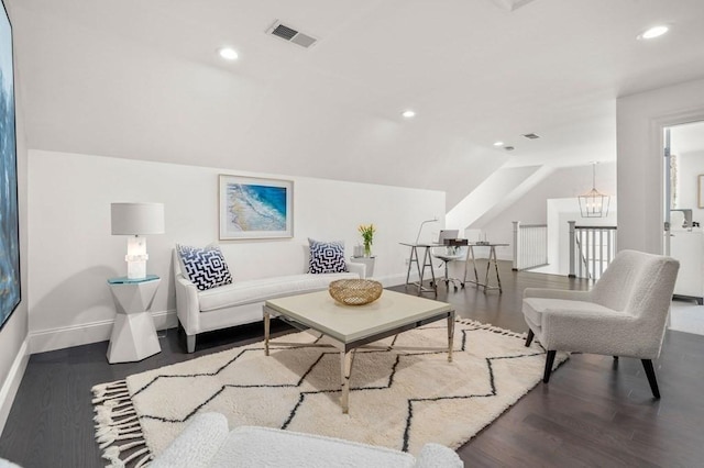 living area featuring baseboards, wood finished floors, vaulted ceiling, recessed lighting, and a chandelier