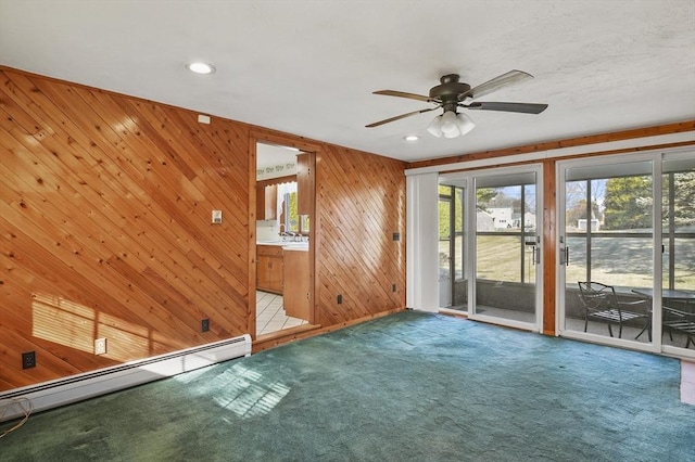 carpeted spare room featuring recessed lighting, a baseboard heating unit, and ceiling fan