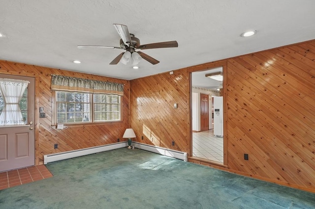 carpeted empty room with recessed lighting, a baseboard radiator, and a ceiling fan