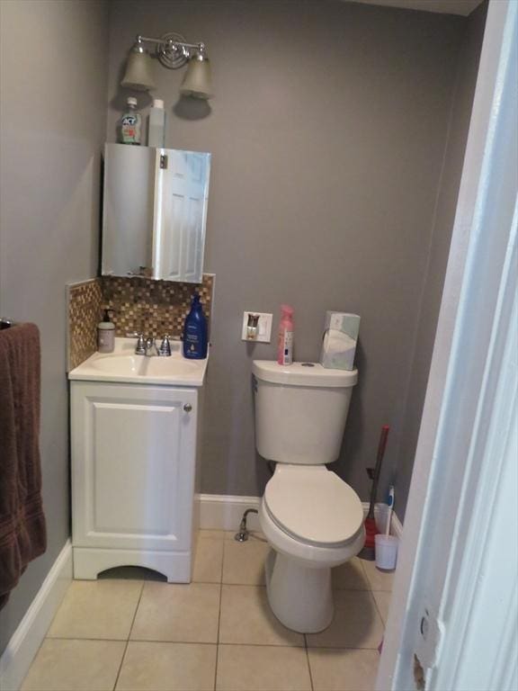 82 Main St, Blackstone, MA 01504 - bathroom with vanity, tile patterned flooring, toilet, baseboards, and decorative backsplash
