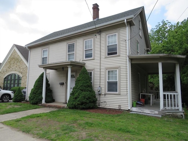 82 Main St, Blackstone, MA 01504 - view of front of property featuring a chimney and a front lawn