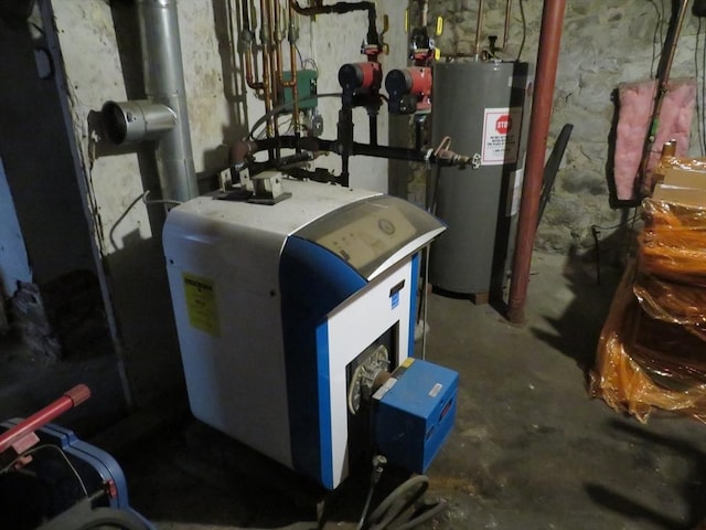 82 Main St, Blackstone, MA 01504 - utility room with electric water heater and a heating unit