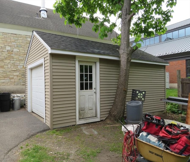 82 Main St, Blackstone, MA 01504 - view of outbuilding featuring a garage and asphalt driveway