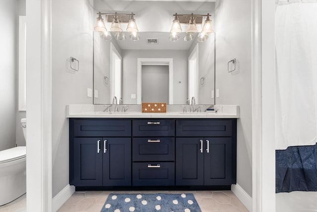 full bathroom featuring double vanity, visible vents, toilet, and a sink