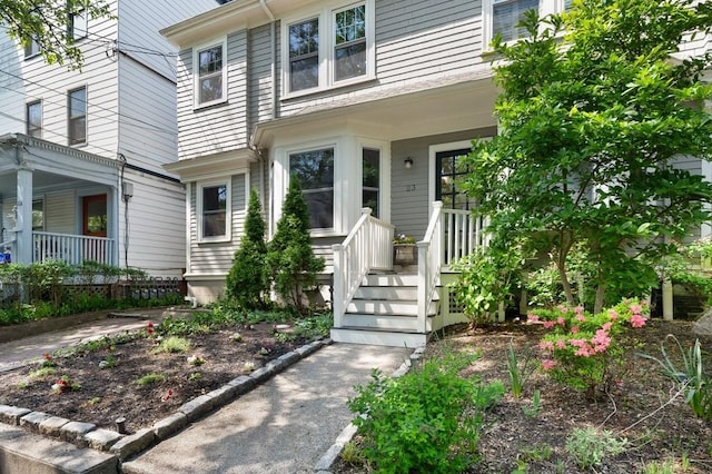 property entrance with covered porch