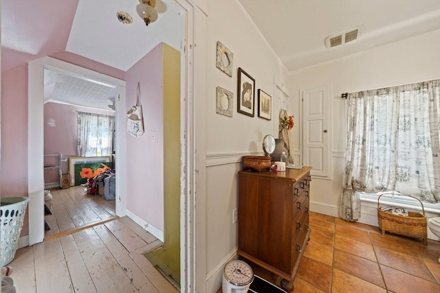 hallway featuring visible vents