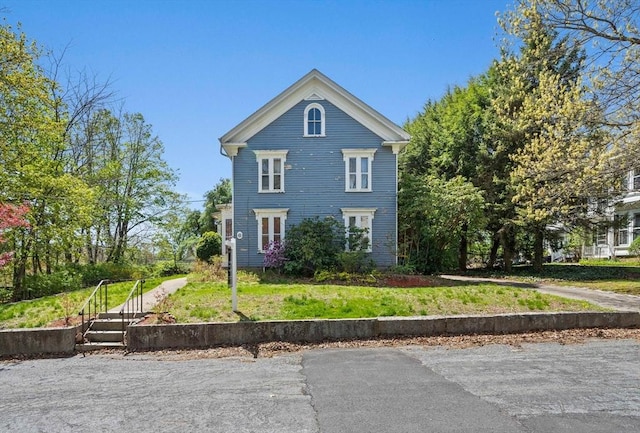 greek revival house with a front yard