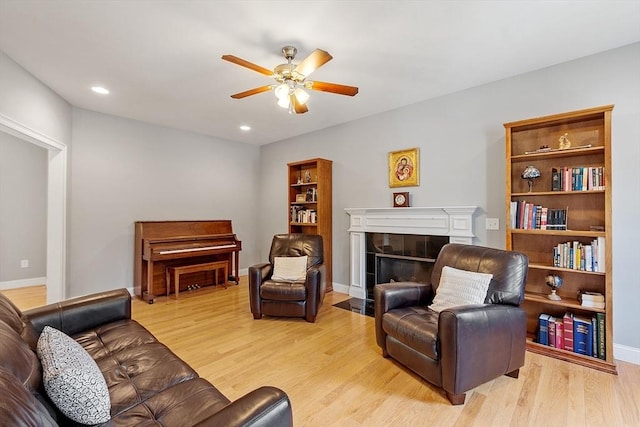 131 Great Rd, Shirley, MA 01464 - living area with ceiling fan, a tiled fireplace, light wood finished floors, and recessed lighting