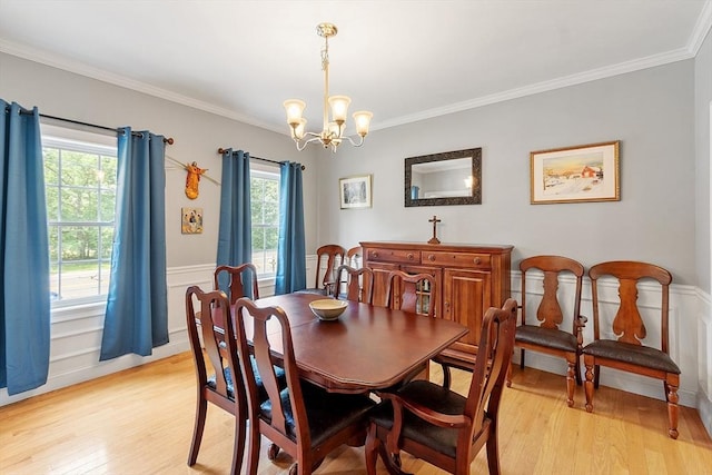 131 Great Rd, Shirley, MA 01464 - dining area with a chandelier, light wood finished floors, wainscoting, and ornamental molding