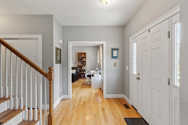 131 Great Rd, Shirley, MA 01464 - foyer entrance with plenty of natural light, light wood-style floors, and stairway