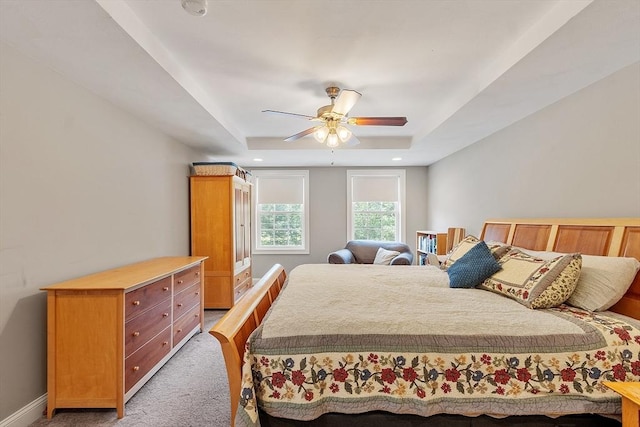 131 Great Rd, Shirley, MA 01464 - bedroom with light colored carpet, a tray ceiling, and ceiling fan