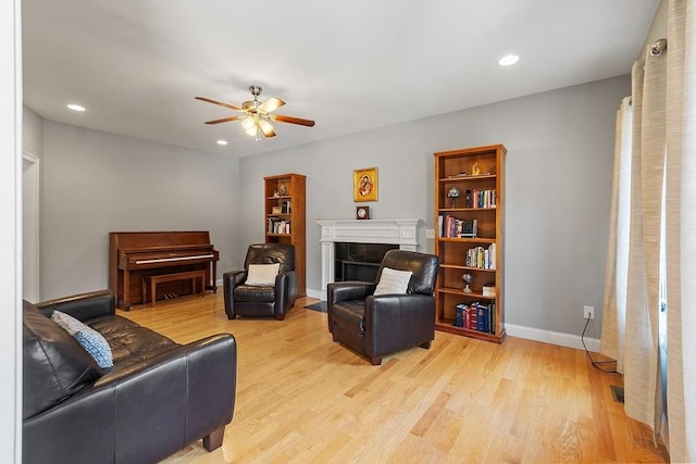 131 Great Rd, Shirley, MA 01464 - living area featuring a tiled fireplace, ceiling fan, light wood-style floors, and recessed lighting