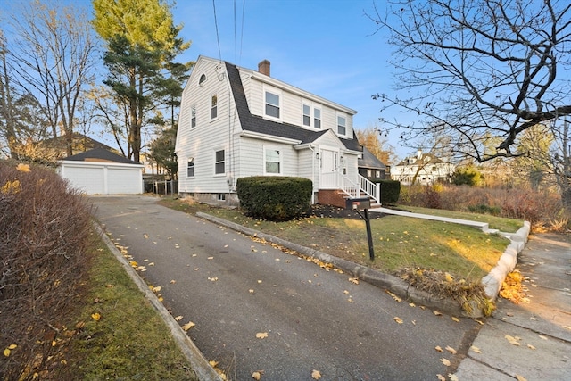 view of side of home with an outbuilding and a garage