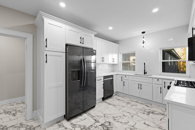 kitchen with black dishwasher, sink, white cabinetry, and fridge with ice dispenser