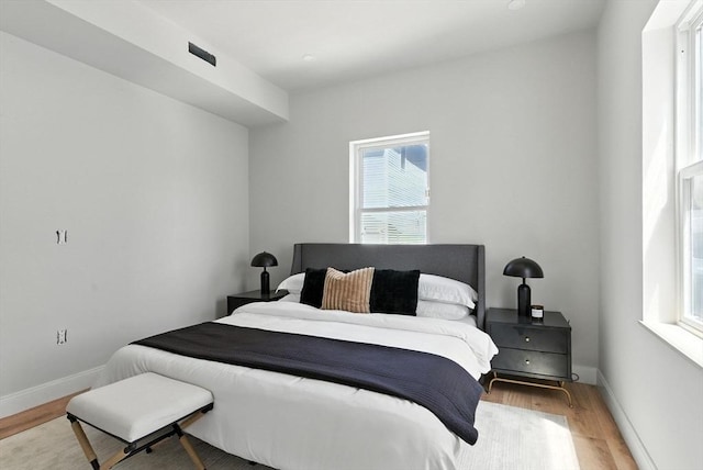34 Woodford St Unit 2, Boston, MA 02125 - bedroom featuring light wood finished floors and baseboards