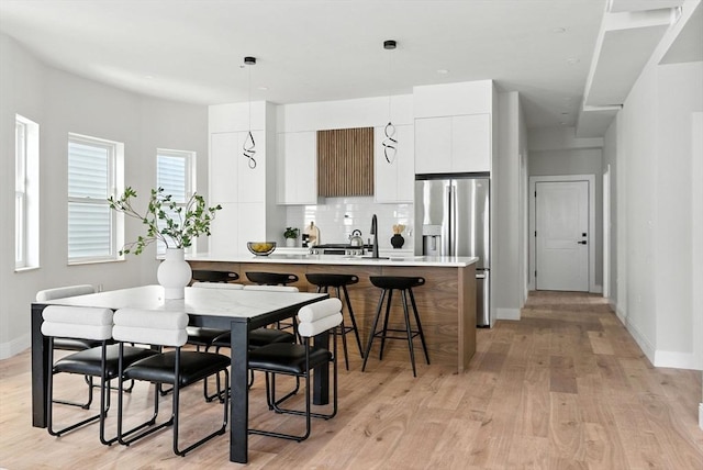 34 Woodford St Unit 2, Boston, MA 02125 - dining area featuring light wood finished floors and baseboards