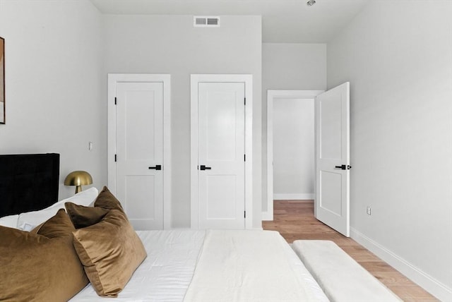 34 Woodford St Unit 2, Boston, MA 02125 - bedroom featuring light wood-type flooring and baseboards