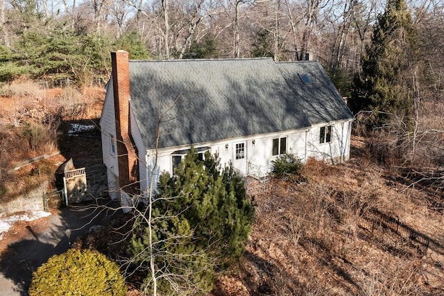 view of side of property with a chimney