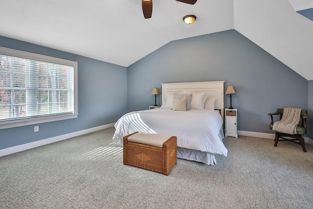 carpeted bedroom with ceiling fan and lofted ceiling