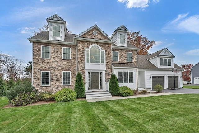 view of front facade featuring a front lawn and a garage