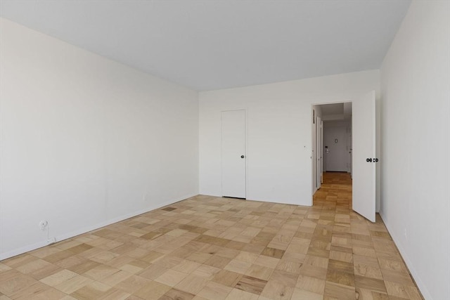 unfurnished bedroom with light parquet floors