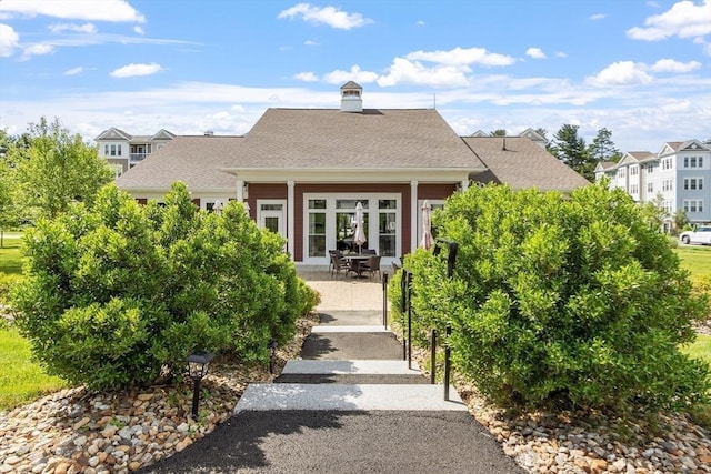 back of property featuring a patio area and french doors