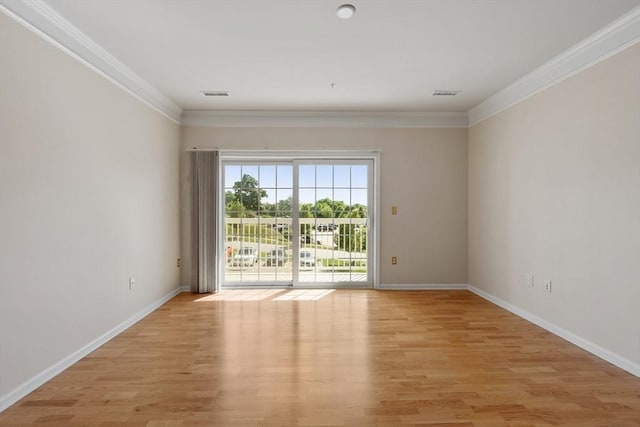 unfurnished room with light hardwood / wood-style flooring and crown molding