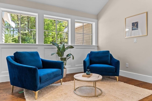 1780 Central Ave, Needham, MA 02492 - living area featuring lofted ceiling, wood finished floors, and baseboards