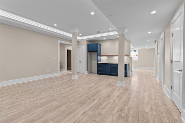 1780 Central Ave, Needham, MA 02492 - unfurnished living room with recessed lighting, baseboards, light wood-style flooring, a sink, and decorative columns