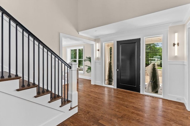 1780 Central Ave, Needham, MA 02492 - foyer featuring healthy amount of natural light, wood finished floors, ornamental molding, and stairs