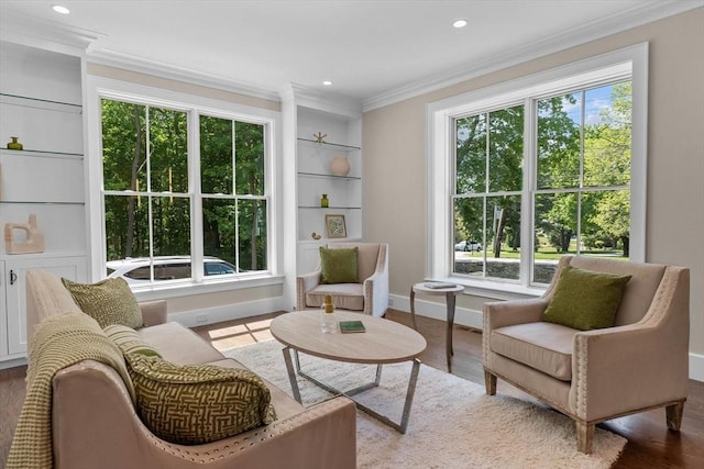 1780 Central Ave, Needham, MA 02492 - living area featuring healthy amount of natural light, crown molding, baseboards, built in shelves, and recessed lighting