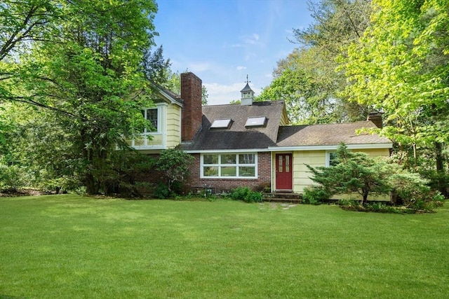 35 Bemis St, Weston, MA 02493 - view of front of house with a front yard and a chimney