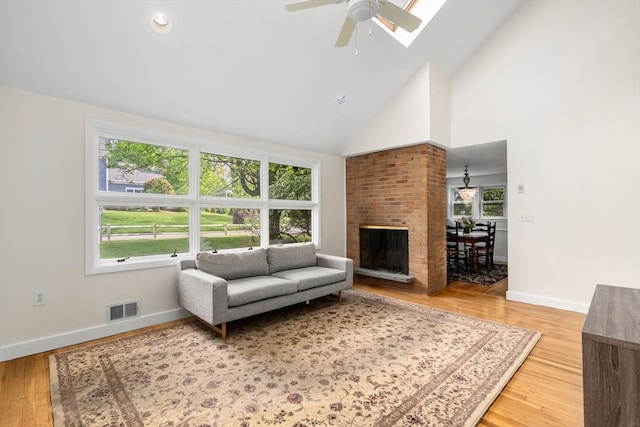 35 Bemis St, Weston, MA 02493 - living area featuring a ceiling fan, high vaulted ceiling, light wood-style flooring, and baseboards