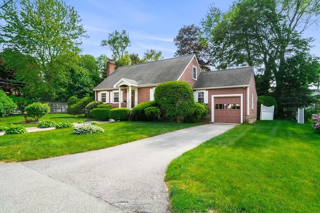 52 Harding Rd, Lexington, MA 02420 - view of front facade with driveway, a front lawn, an attached garage, and a chimney