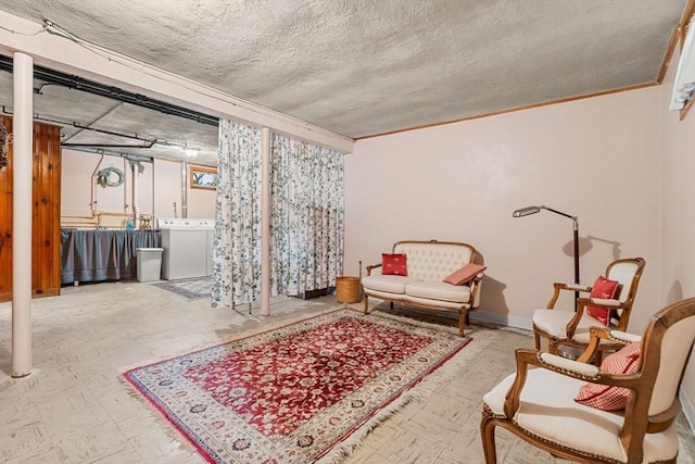 52 Harding Rd, Lexington, MA 02420 - living area featuring washer / dryer, tile patterned floors, a textured ceiling, crown molding, and baseboards