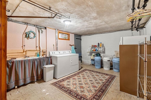 52 Harding Rd, Lexington, MA 02420 - laundry area with washing machine and clothes dryer, concrete block wall, and tile patterned floors