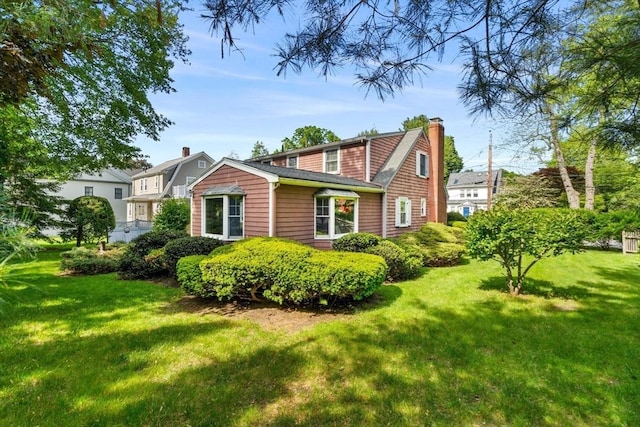 52 Harding Rd, Lexington, MA 02420 - view of front of property featuring a chimney and a front yard