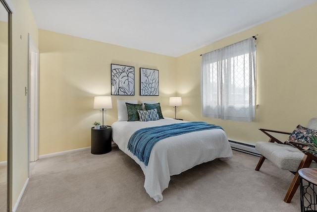bedroom featuring a baseboard radiator, carpet floors, and baseboards