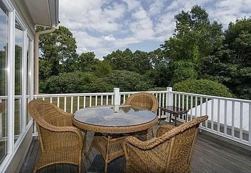 wooden balcony featuring a deck