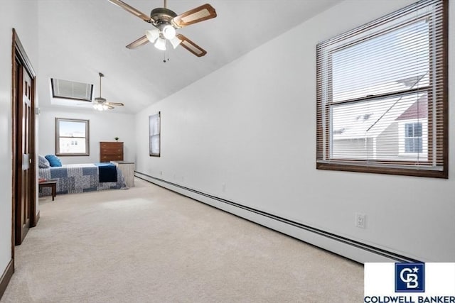 interior space featuring lofted ceiling, ceiling fan, and a baseboard heating unit