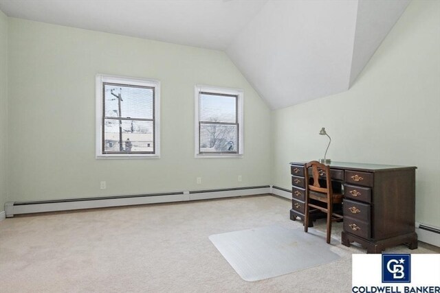 carpeted office with lofted ceiling and a baseboard heating unit