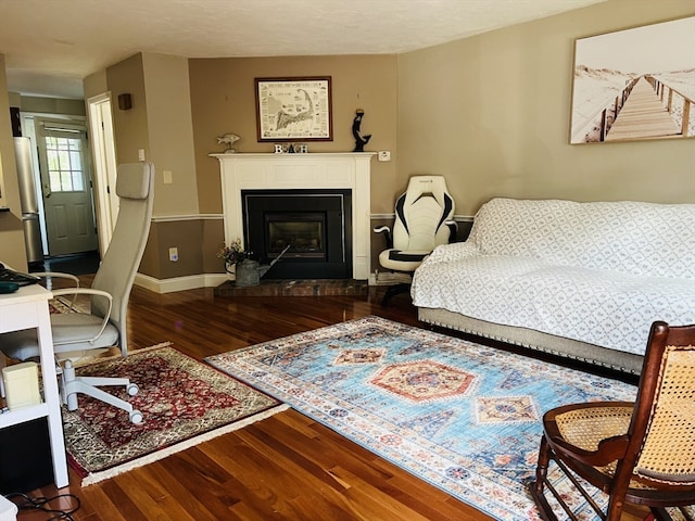 living room with hardwood / wood-style floors and a textured ceiling