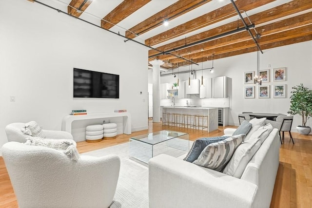 33 Sleeper St Unit 106, Boston, MA 02210 - living room featuring light wood finished floors and a towering ceiling